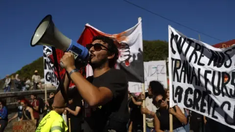 Nationwide Strikes Erupt In Response to Fiscal Cuts
