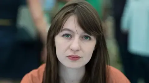 Irish author Sally Rooney claims she cannot enter the UK over potential arrest
